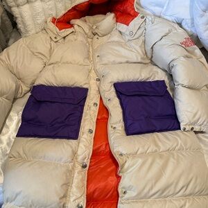 The North Face Beige Puffer Coat with Purple Pockets and Orange Lining